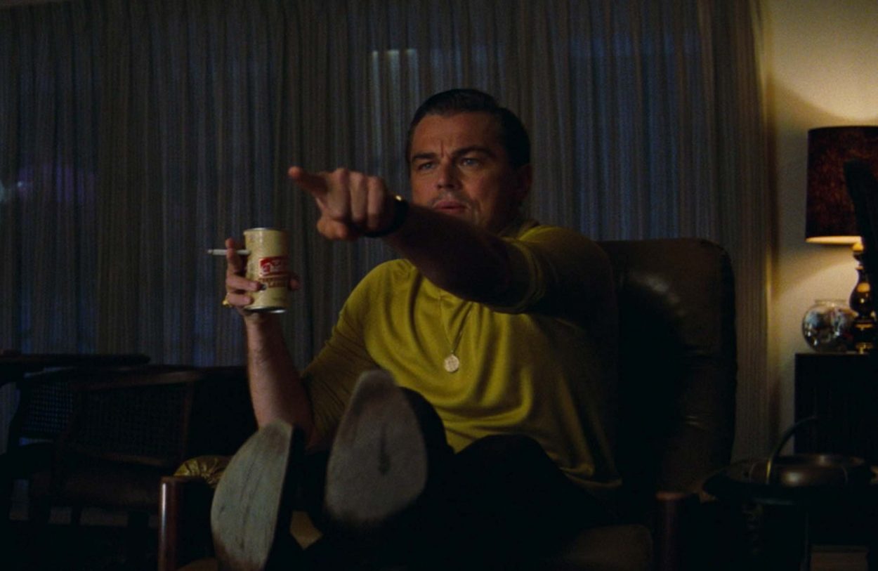 Before: a soft, lower-resolution still of a man pointing
